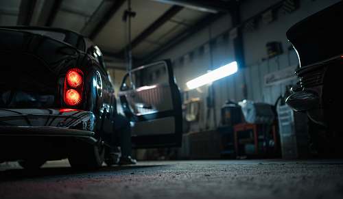 garage black car wheeled vehicle