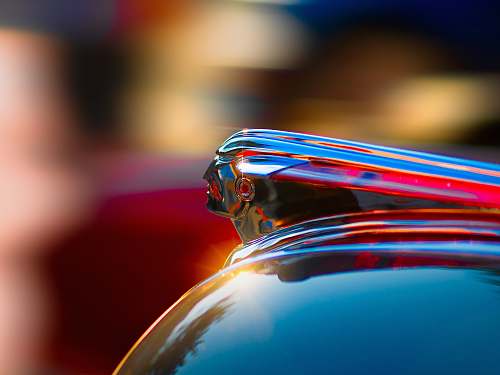 shiny selective photography of glass container hood ornament