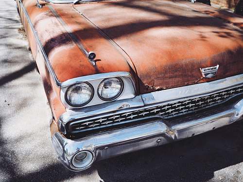 vintage vintage orange car during daytime automobile