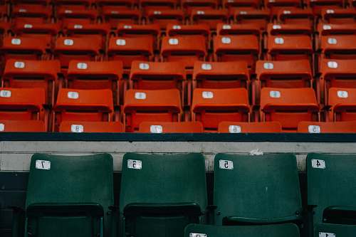 luggage green and orange theatre chairs seats