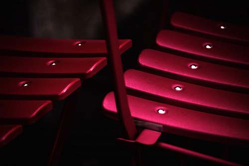 italy shallow focus photography of pink metal chair furniture