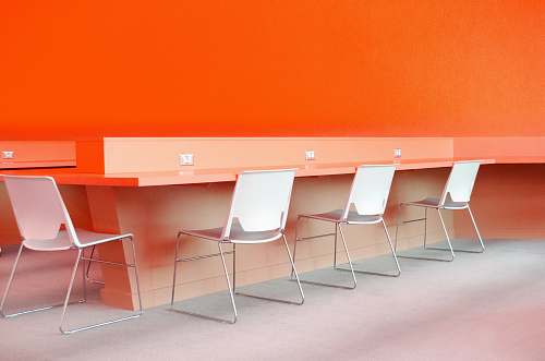 furniture white plastic chairs under desk table