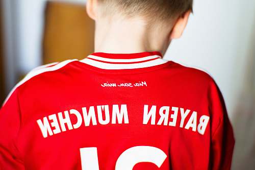 apparel boy in a red Bayern Munchen jersey shirt shirt