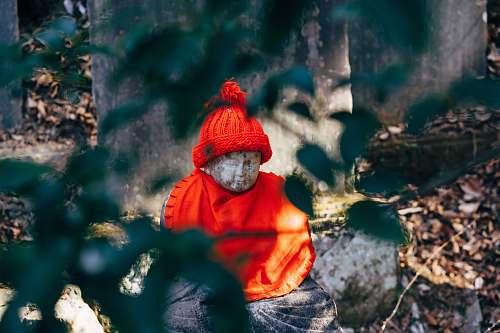 apparel statue with red knit cap hat