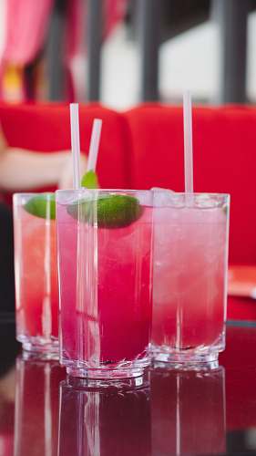 beverage three pint glasses with beverages in table alcohol