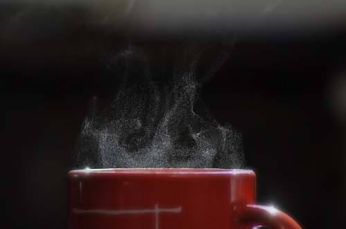 cup smoke coming out from mug filled with beverage coffee cup