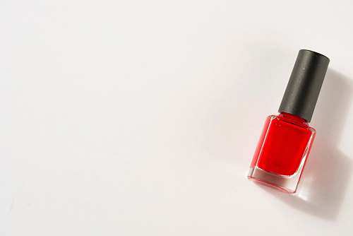 beauty photo of red nail polish lipstick