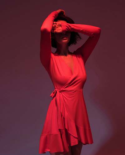 apparel woman wearing pink long-sleeved dress covering her face clothing