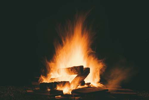 orange fire during night time burning