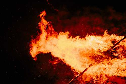 flame stick exposed in fire at nighttime night