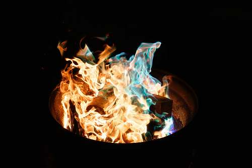 blue fire burning in barrel flames