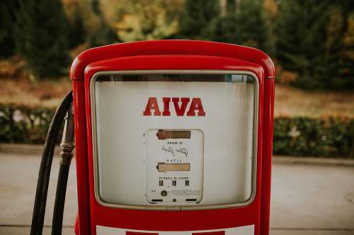 jar shallow focus photography of white Avia gas pump plant
