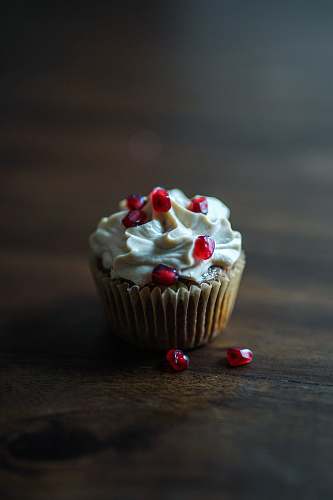cake baked cupcake with white icing on top cupcake