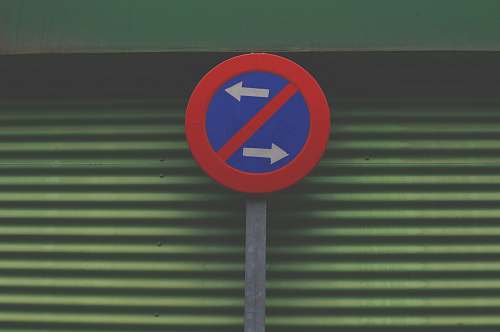 sign sign prohibiting going left or right arrows