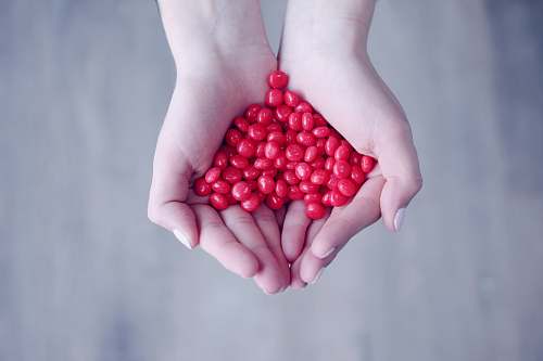 ogden person holding red candies on her palms united states