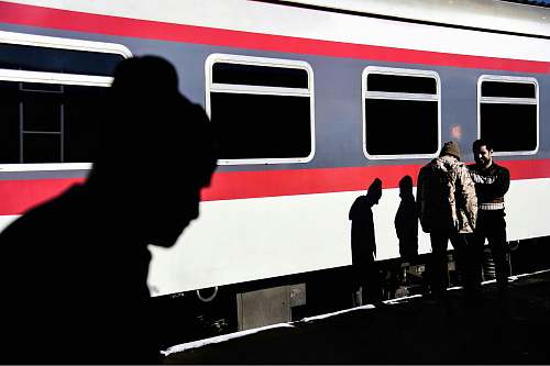 person black and white car door train station
