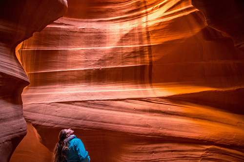people brown haired woman inside the cave person