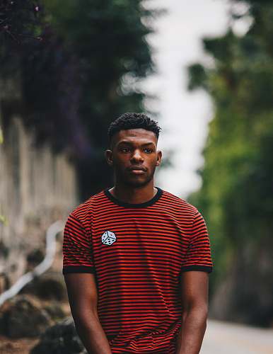 people man wearing red and black striped ringer shirt person