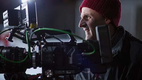 person person facing black and gray professional camera people