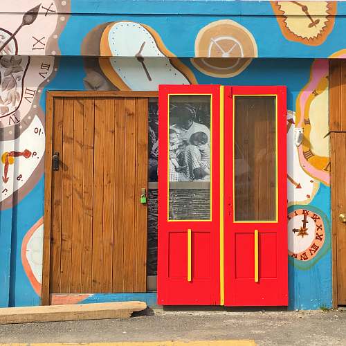 person red and brown wooden doors people