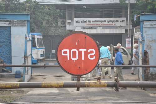 person red and white stop signage symbol
