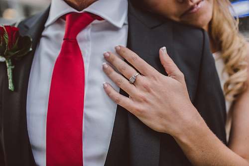 person woman hugging man in suit jacket people