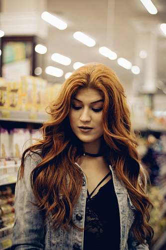 person woman looking down hair
