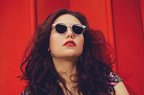 sunglasses woman wearing black and pink cap-sleeved shirt face