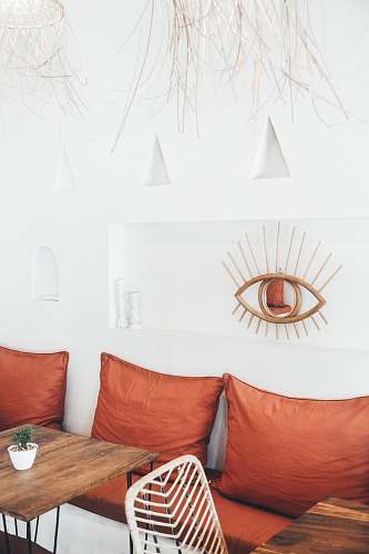 room three red throw pillows behind tables canggu