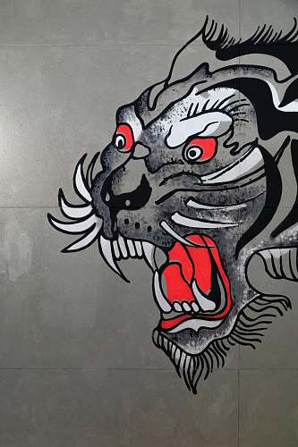 text gray, black, and white tiger art on wall graffiti