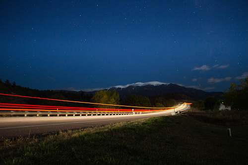 rye time lapse photograph of train under starry sky united states