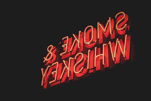 neon yellow and red Smoke & Whiskey LED signage dynamite