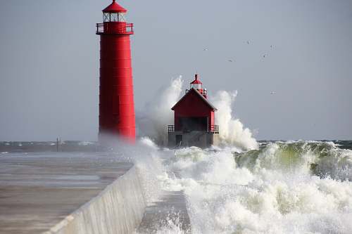 beacon red lighthouse near sea coast