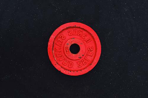 symbol 11.3 kgs red barbell plate trademark