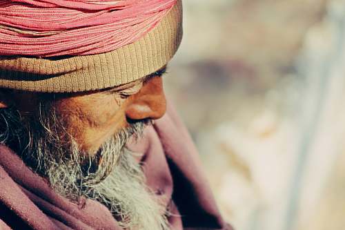 male old man wearing traditional suit during daytime face