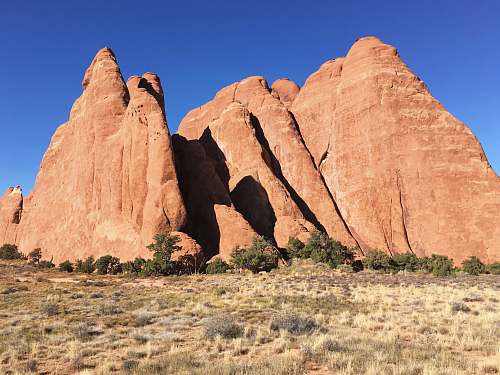 rock brown rock formation at daytime blue
