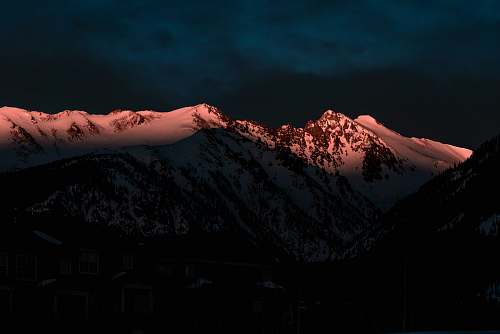 snow ice-capped mountain at night time sunlight