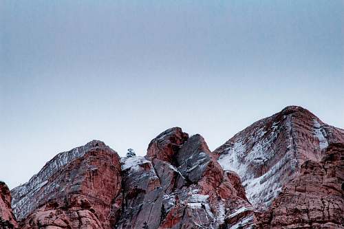 rock landscape photography of cliff crest