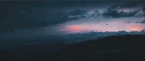 sky landscape photography of mountains during nighttime clouds