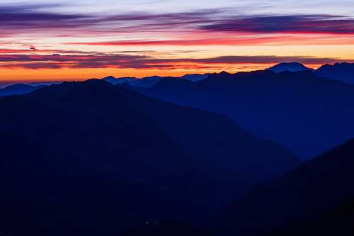 sunset mountain ranges under orange sky during sunset sunrise