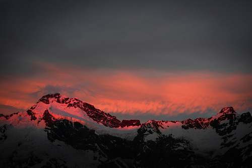 sunset snow covered mountain at golden hour sunrise
