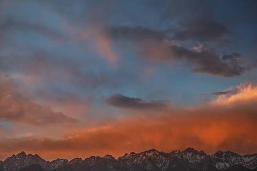 sunset gray mountain range during sunset sky