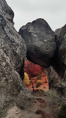 outdoors gray rock formation under white sky during daytime rock