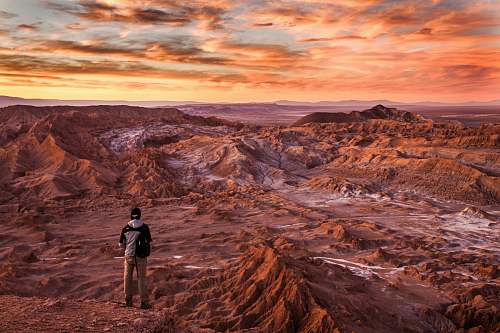mountain man standing near mountains landscape
