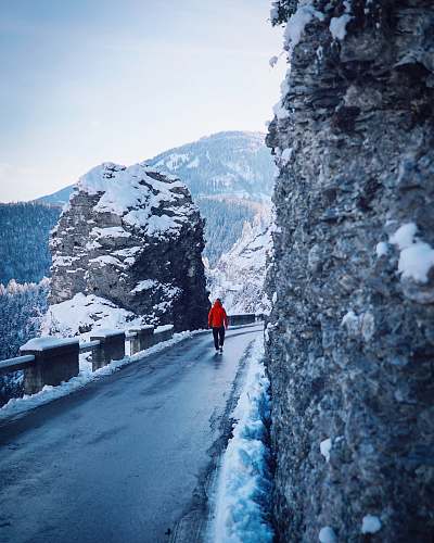 mountain man walking on street at daytime snow