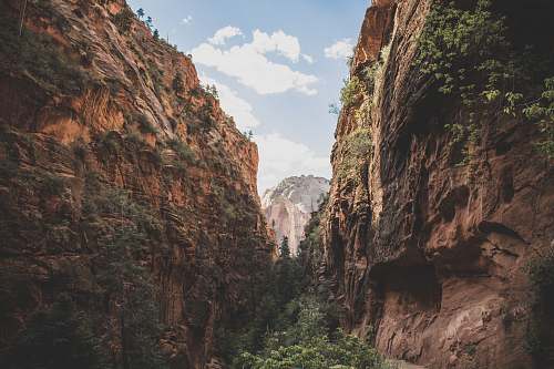 canyon pathway between brown cliffs mountain