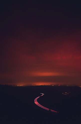 outdoors road under grey clouds sunset