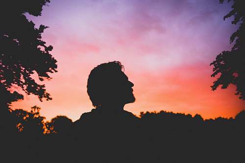 sunset silhouette of man during sunset silhouette