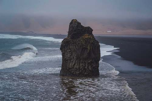sea rock formation on body of water nature