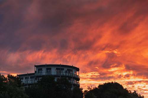 nature white 3-storey house during golden hour sky